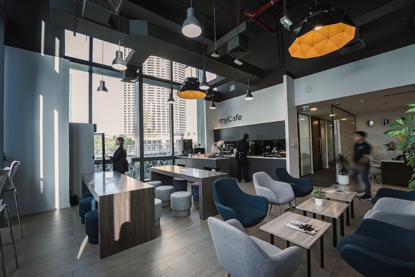 A spacious and welcoming cafeteria inside a managed office in Dubai, by myOffice