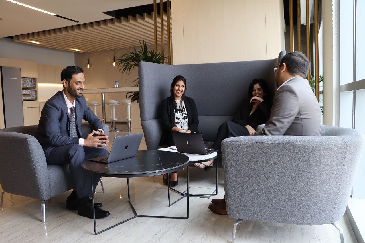 myOffice space for business setup in Dubai Mainland, featuring professionals collaborating in a modern office environment.