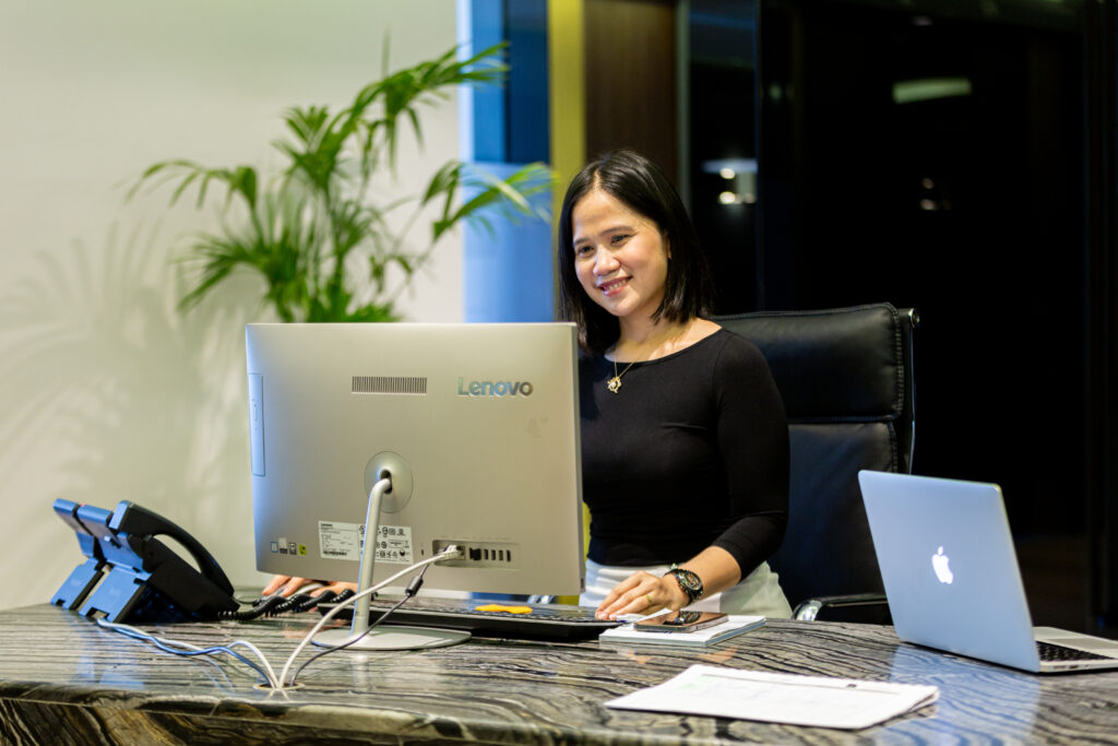 A professional lady working on a desktop at myOffice.